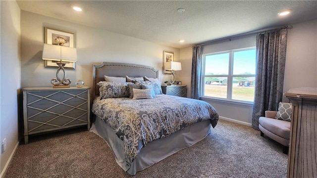 carpeted bedroom featuring recessed lighting, a textured ceiling, and baseboards