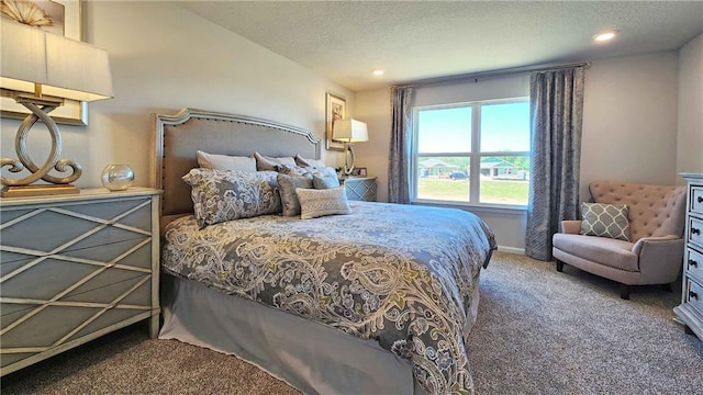 carpeted bedroom with recessed lighting, a textured ceiling, and baseboards