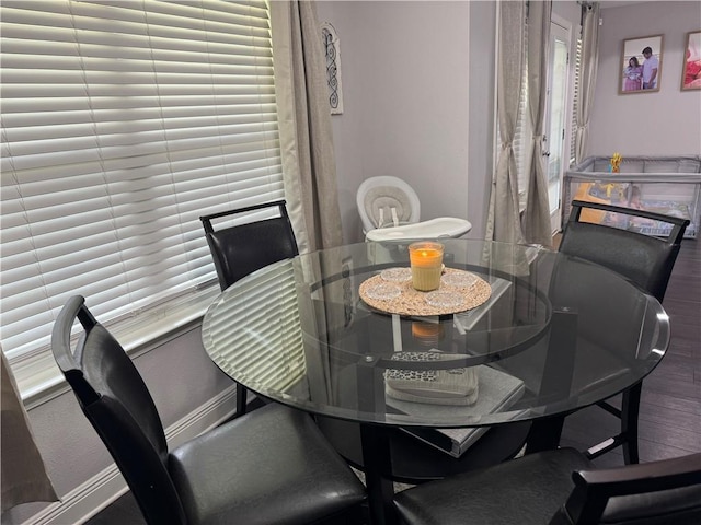 dining area with wood finished floors