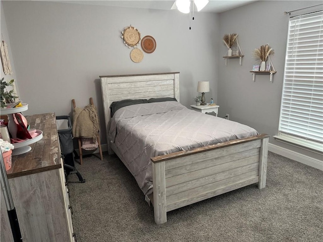 carpeted bedroom featuring baseboards