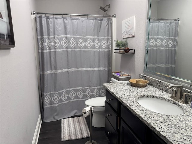 full bathroom featuring a shower with curtain, vanity, toilet, and wood finished floors