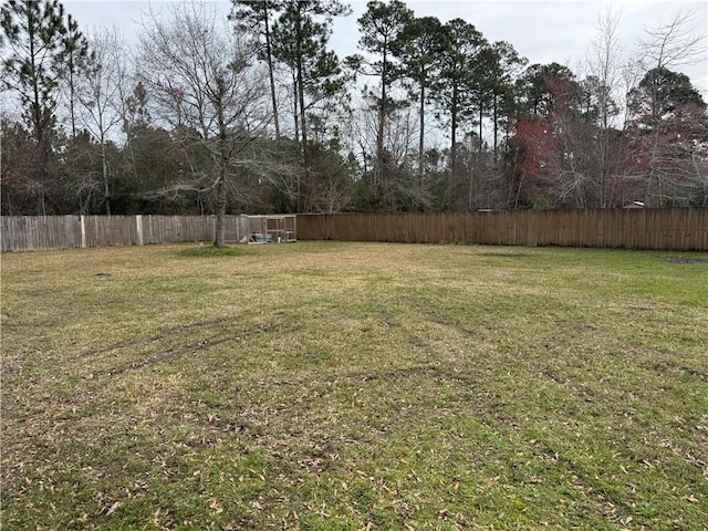 view of yard featuring a fenced backyard