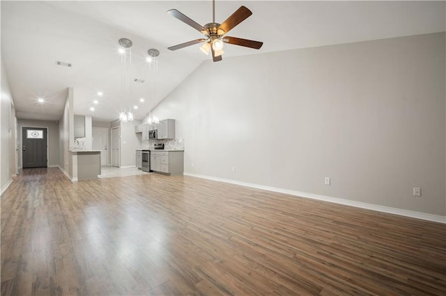 647 Spring Lake Ct, Mobile, AL 36695 - unfurnished living room featuring vaulted ceiling, a ceiling fan, light wood-type flooring, and recessed lighting