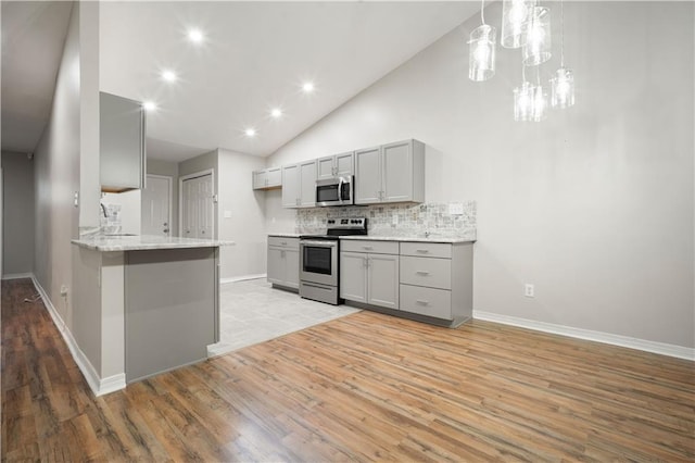 647 Spring Lake Ct, Mobile, AL 36695 - kitchen with appliances with stainless steel finishes, gray cabinets, light wood-style floors, backsplash, and recessed lighting