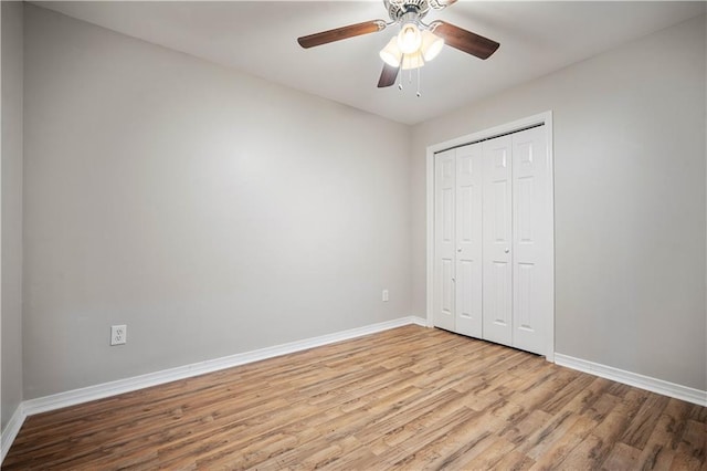 647 Spring Lake Ct, Mobile, AL 36695 - unfurnished bedroom featuring wood finished floors, a closet, and a ceiling fan