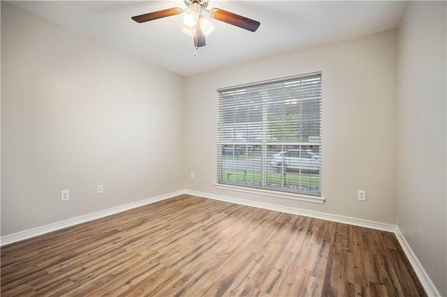 647 Spring Lake Ct, Mobile, AL 36695 - empty room with wood finished floors and a ceiling fan