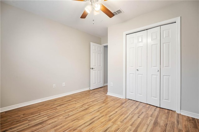 647 Spring Lake Ct, Mobile, AL 36695 - unfurnished bedroom featuring light wood-style flooring, a closet, and ceiling fan