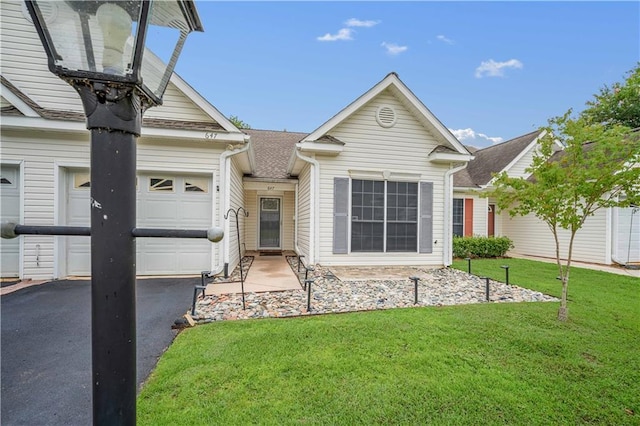 647 Spring Lake Ct, Mobile, AL 36695 - view of front of house with an attached garage, a front lawn, driveway, and roof with shingles