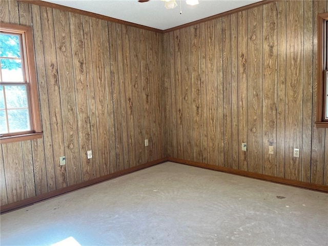 spare room with concrete flooring and baseboards