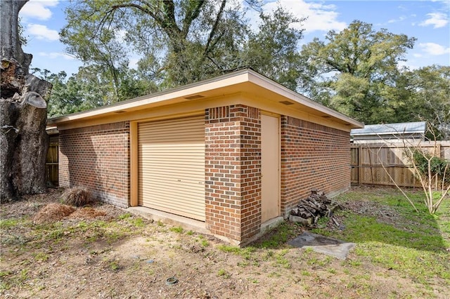 view of outdoor structure with fence