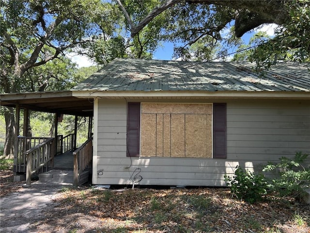 view of property exterior featuring metal roof