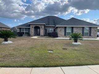 single story home featuring a front yard