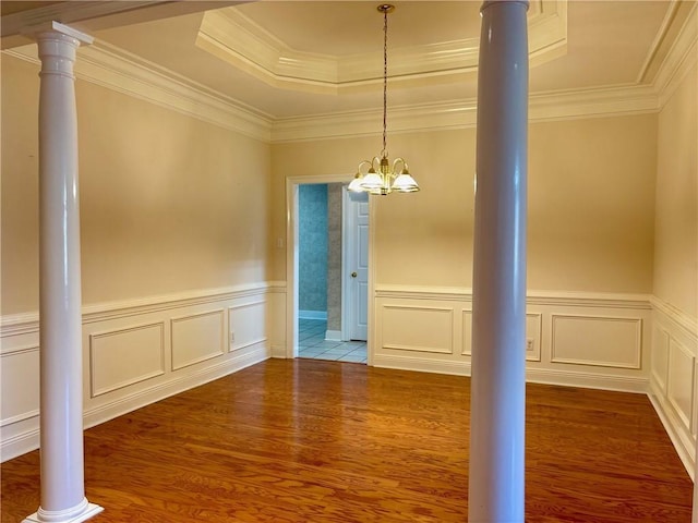 734 Natchez Trail Ct, Mobile, AL 36609 - unfurnished dining area with an inviting chandelier, ornamental molding, a raised ceiling, and wood finished floors