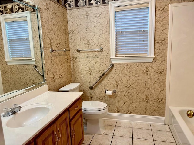 734 Natchez Trail Ct, Mobile, AL 36609 - full bathroom featuring tile patterned flooring, vanity, toilet, a washtub, and baseboards