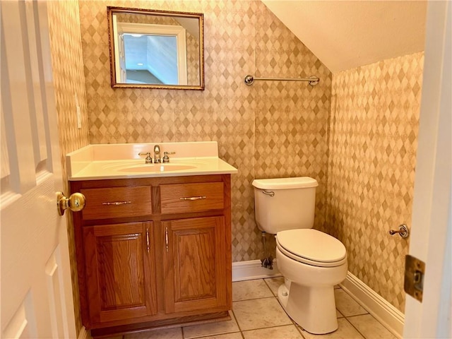 734 Natchez Trail Ct, Mobile, AL 36609 - half bathroom featuring vanity, toilet, tile patterned floors, wallpapered walls, and vaulted ceiling