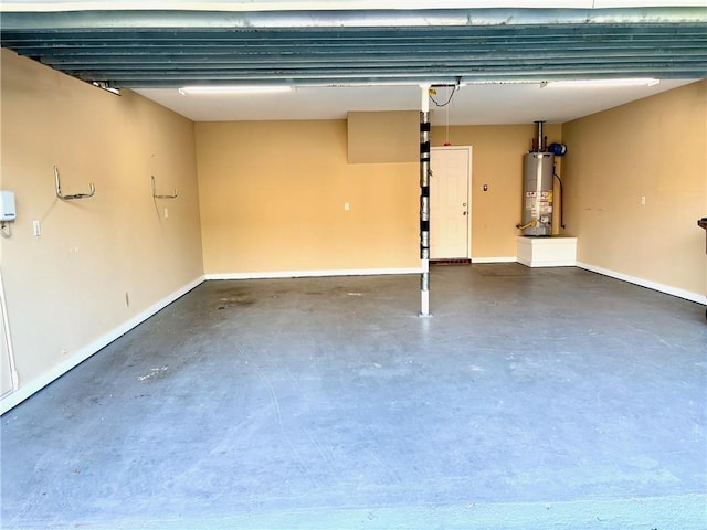 734 Natchez Trail Ct, Mobile, AL 36609 - garage with baseboards and gas water heater