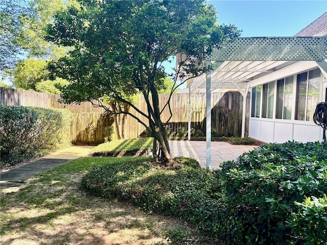 734 Natchez Trail Ct, Mobile, AL 36609 - view of yard featuring a fenced backyard, a pergola, a sunroom, and a patio