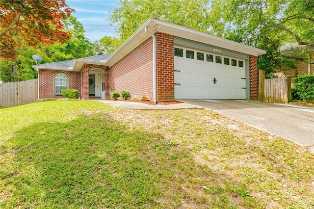 view of front of house featuring a front yard and a garage