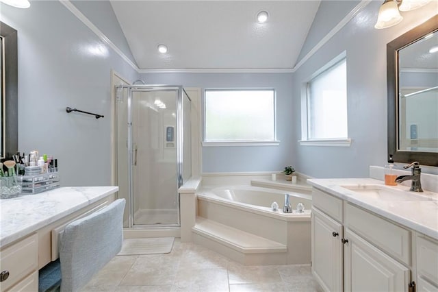 bathroom with independent shower and bath, tile patterned flooring, vaulted ceiling, and vanity