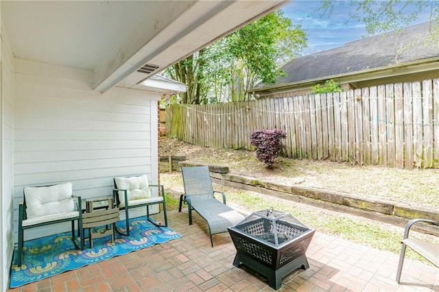 view of patio featuring an outdoor fire pit