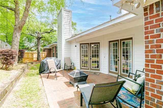 view of patio / terrace with french doors and a grill