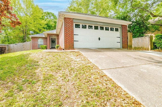 view of front facade featuring a garage and a front lawn