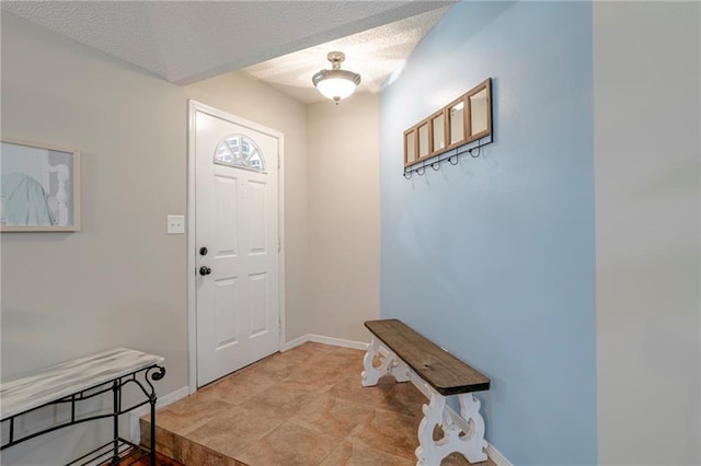 entryway featuring a textured ceiling