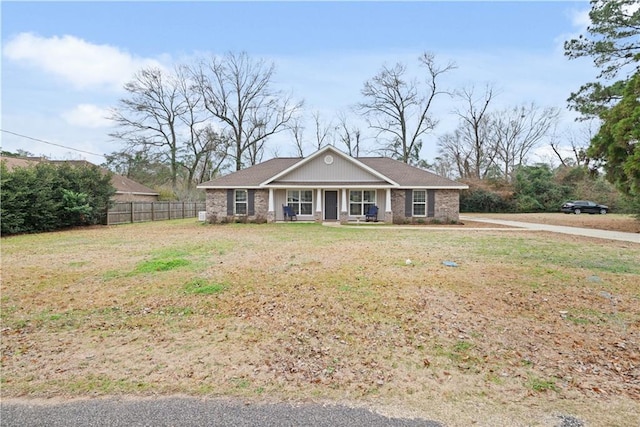 single story home featuring a front lawn