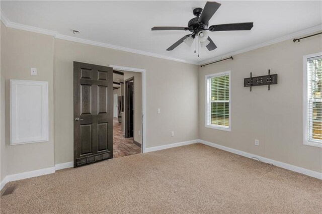 unfurnished bedroom featuring a spacious closet, ceiling fan, connected bathroom, and light colored carpet