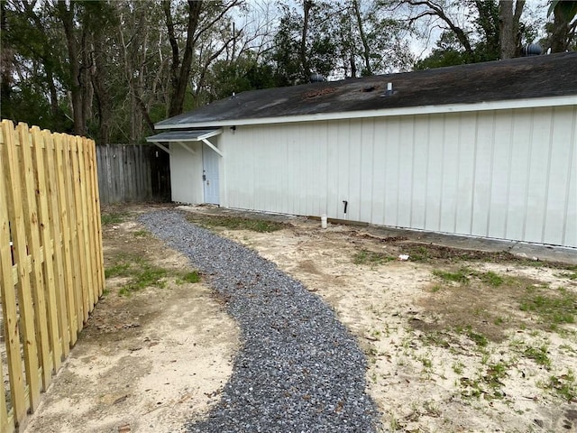 view of home's exterior featuring fence