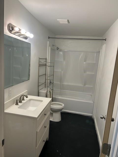 bathroom with shower / bathtub combination, vanity, and toilet