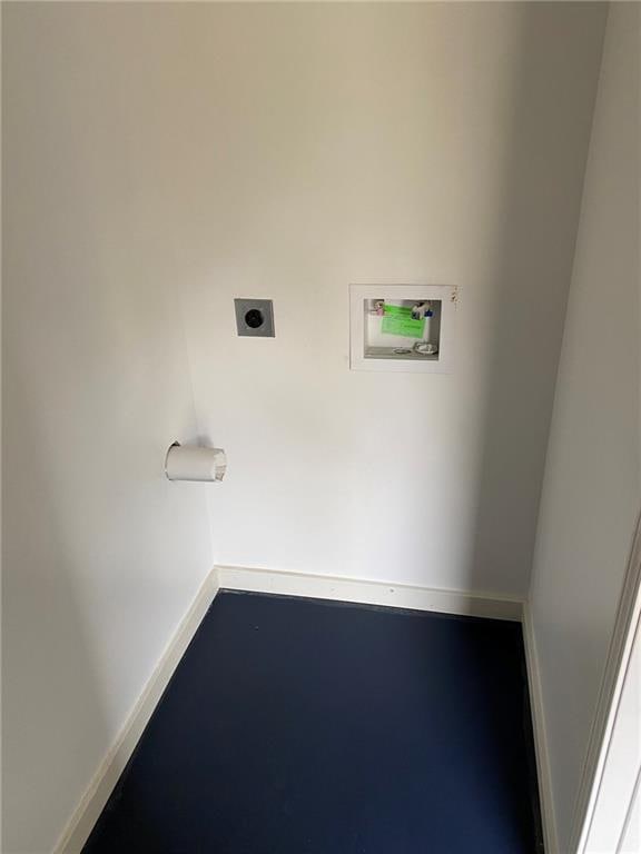clothes washing area with laundry area, baseboards, washer hookup, and hookup for an electric dryer