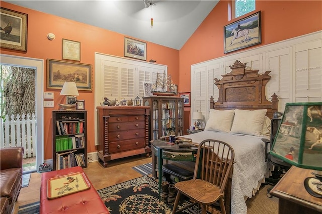 tiled bedroom featuring multiple windows, high vaulted ceiling, and ceiling fan