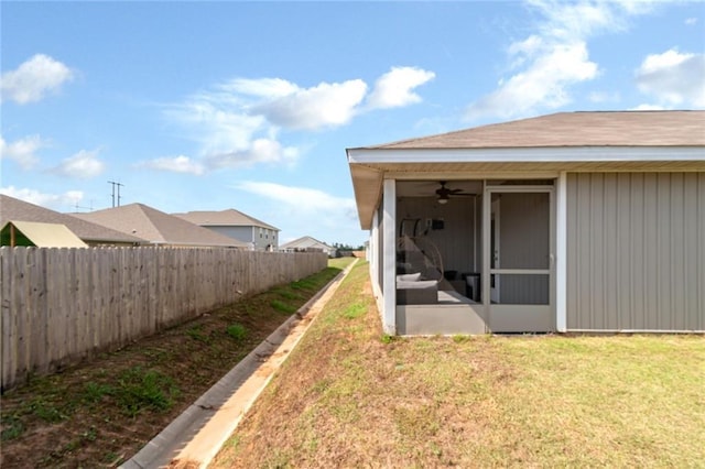 20675 Mercury Dr, Robertsdale, AL 36567 - view of yard with a sunroom and ceiling fan