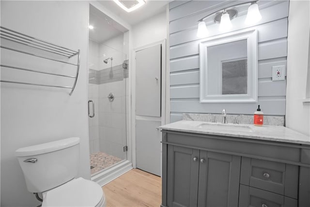 1008 Chalet Dr W, Mobile, AL 36608 - bathroom with a shower stall, vanity, and wood finished floors