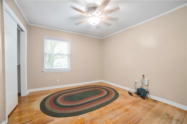 1008 Chalet Dr W, Mobile, AL 36608 - unfurnished bedroom with wood finished floors, crown molding, a ceiling fan, and a closet