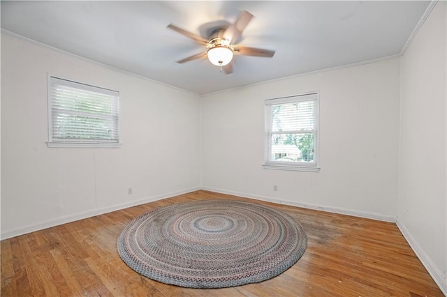 1008 Chalet Dr W, Mobile, AL 36608 - spare room featuring ornamental molding, a ceiling fan, and wood finished floors
