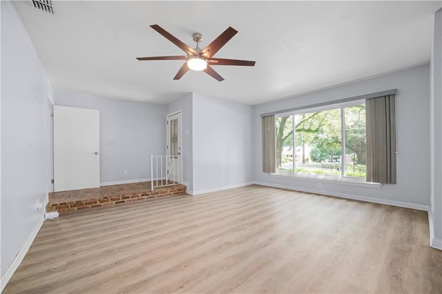 1008 Chalet Dr W, Mobile, AL 36608 - unfurnished living room featuring ceiling fan and light wood-style flooring