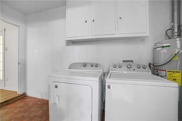 1008 Chalet Dr W, Mobile, AL 36608 - laundry room featuring washing machine and dryer, electric water heater, cabinet space, and brick patterned floors