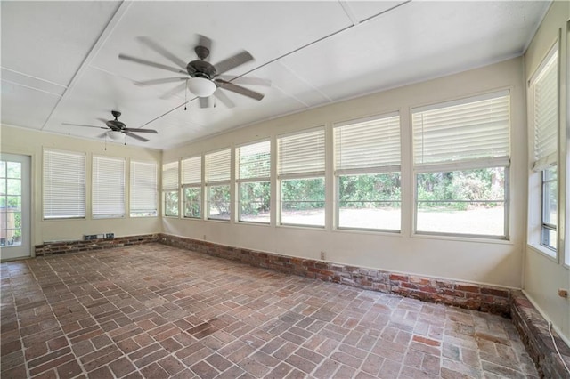 1008 Chalet Dr W, Mobile, AL 36608 - unfurnished sunroom with brick flooring and baseboards