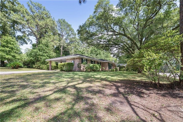 1008 Chalet Dr W, Mobile, AL 36608 - view of front facade featuring a front yard, brick siding, and a carport