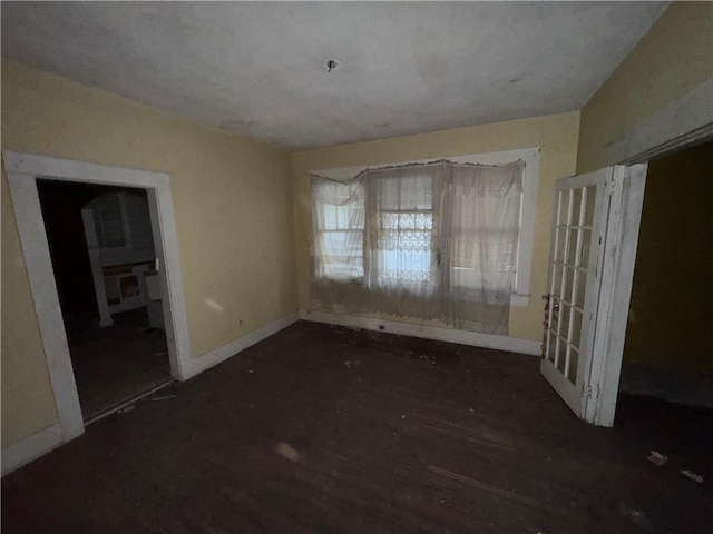 unfurnished dining area featuring dark hardwood / wood-style floors