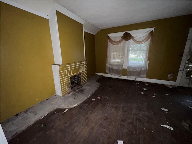 unfurnished living room with wood-type flooring