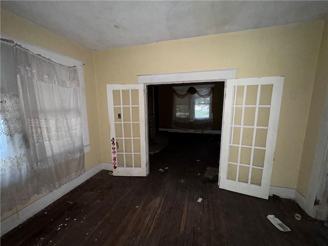 unfurnished dining area featuring dark hardwood / wood-style floors