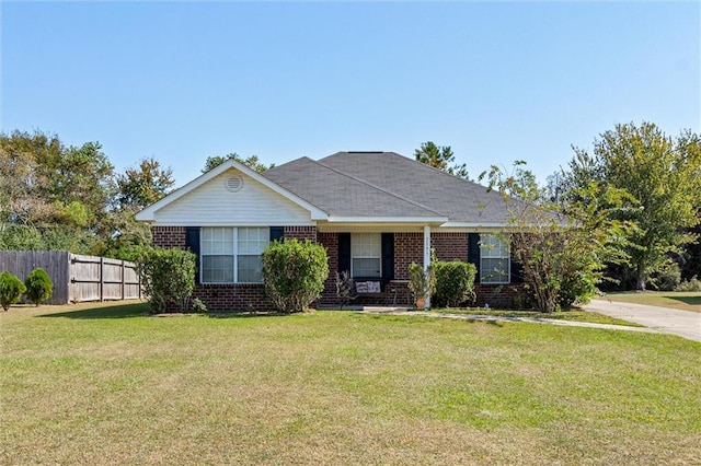 single story home with a front lawn