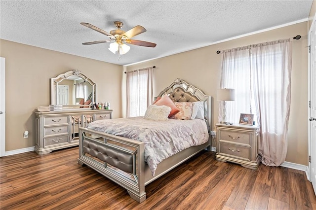 bedroom featuring a textured ceiling, ceiling fan, and dark hardwood / wood-style flooring