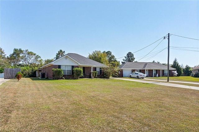 ranch-style house with a front lawn and a garage