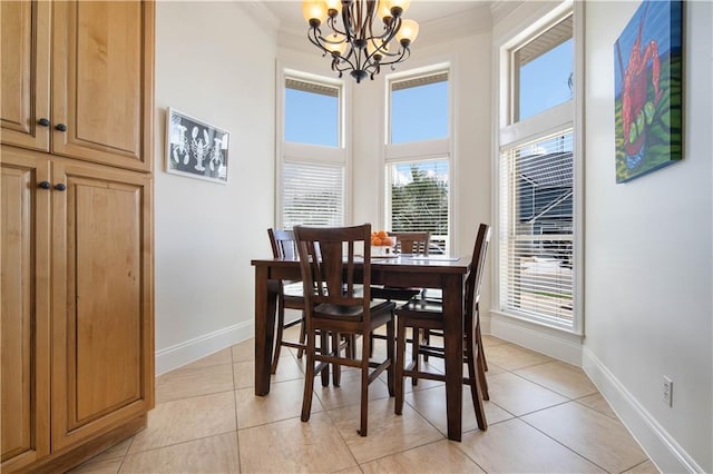 tiled dining space with a wealth of natural light, crown molding, and an inviting chandelier