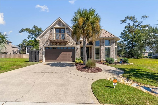 view of front of home with a garage and a front yard