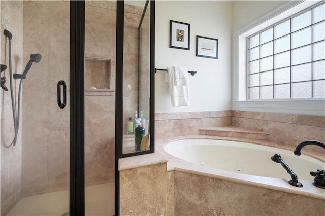 bathroom with separate shower and tub